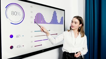 Woman teaching with digital charts